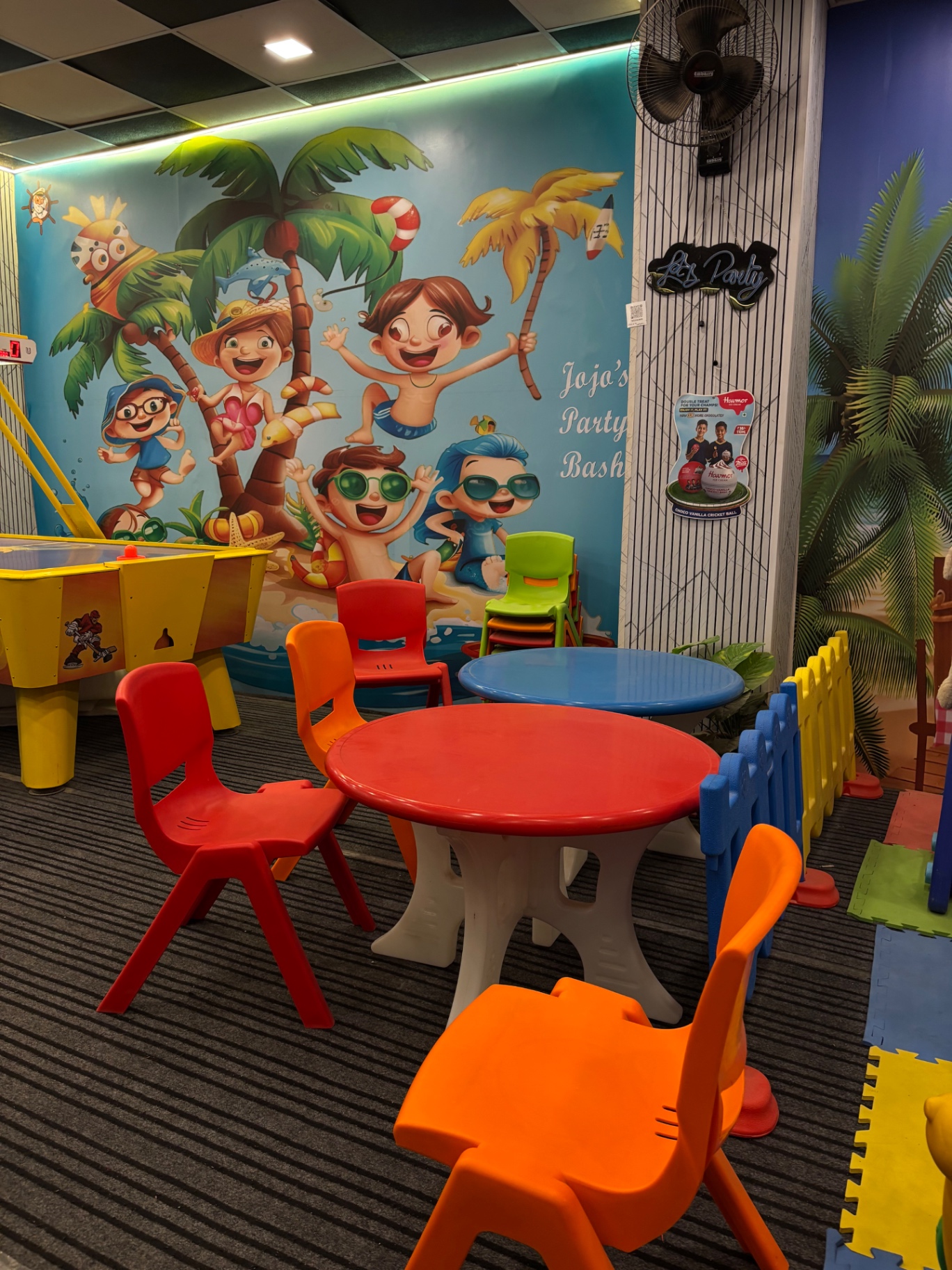 JOJO'S party bash area with themed mural